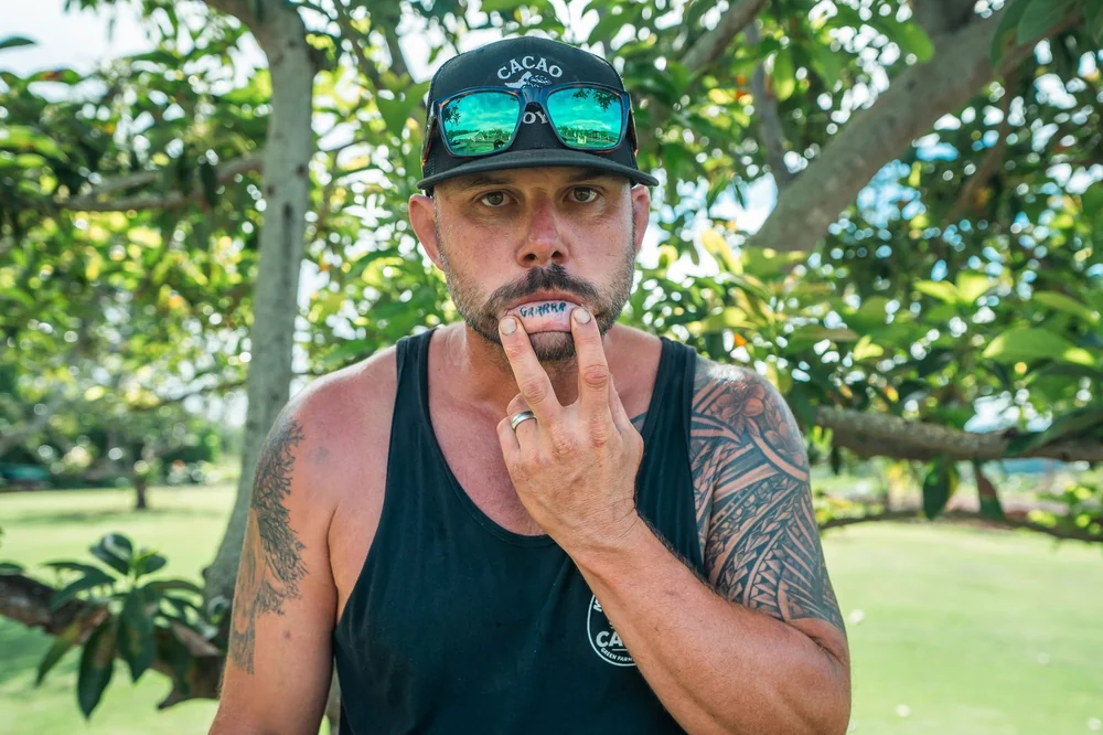 Pete tasting fresh cacao on the farm